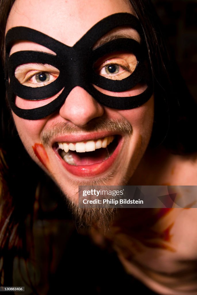 Actor with a mask and fake blood