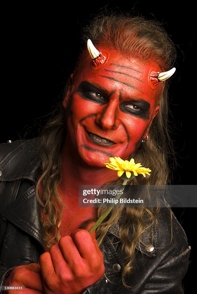 Red devil with yellow flower