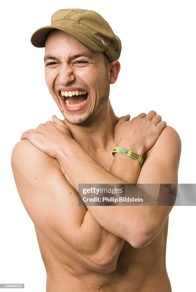 Laughing young man with bare chest