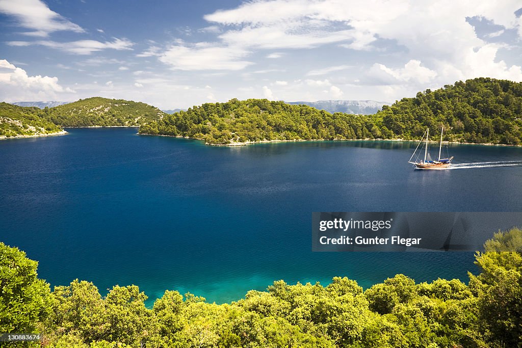 Group of islands with a sailing boat, Mljet National Park, Mljet Island, Dubrovnik-Neretva, Dalmatia, Croatia, Europe