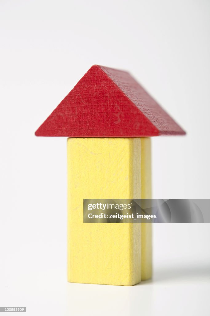Yellow house, made of building bricks