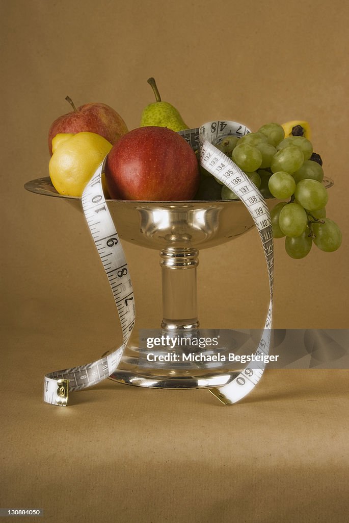 Fruit basket with fruits and measuring tape
