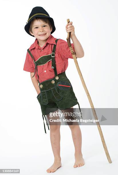 boy, 4 years old, in traditional costume, with walking cane - baviera foto e immagini stock