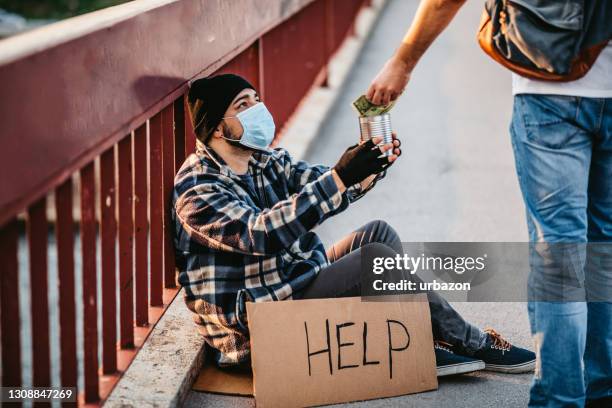 homeless man begging for money - begging stock pictures, royalty-free photos & images