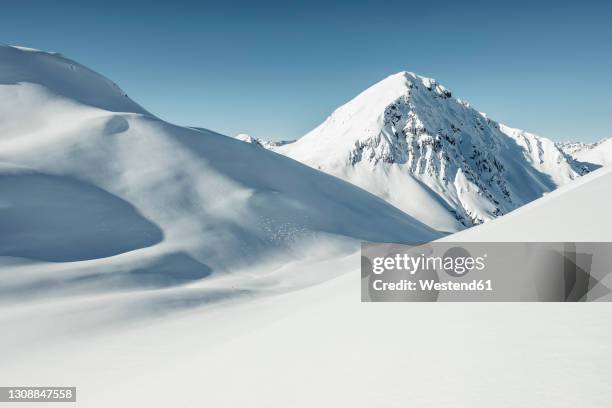 kreuzjoch and ortkopf covered in snow during sunny day, lechtal alps, tyrol, austria - ski hill stock pictures, royalty-free photos & images