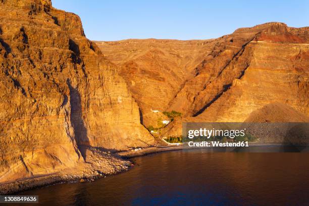 spain, valle gran rey, drone view of barranco de argaga gorge and playa de argaga beach at dusk - gomera bildbanksfoton och bilder