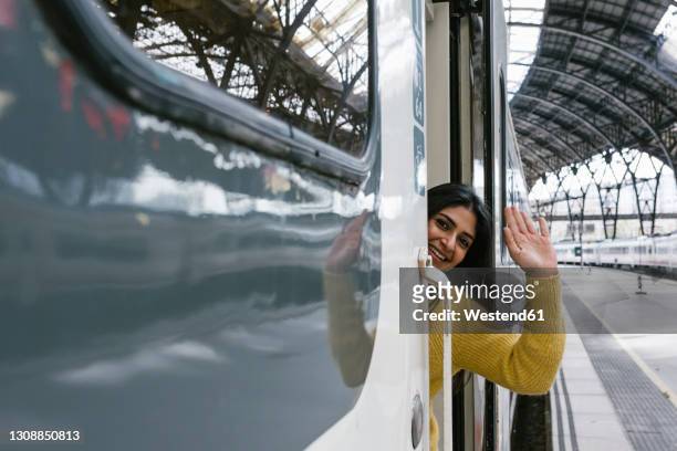 woman in train - train leaving stock pictures, royalty-free photos & images