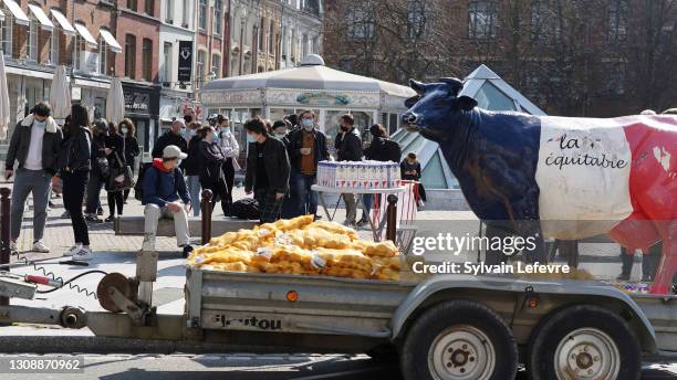 French farmers of Northern France distribute milk and potatoes to help students in need during a food distribution operation on March 24, 2021 in...