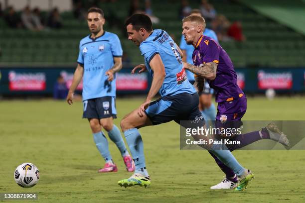 Ryan McGowan of Sydney wins the ball against Andy Keogh of the Glory during the round 13 A-League match between Perth Glory and Sydney FC at HBF...