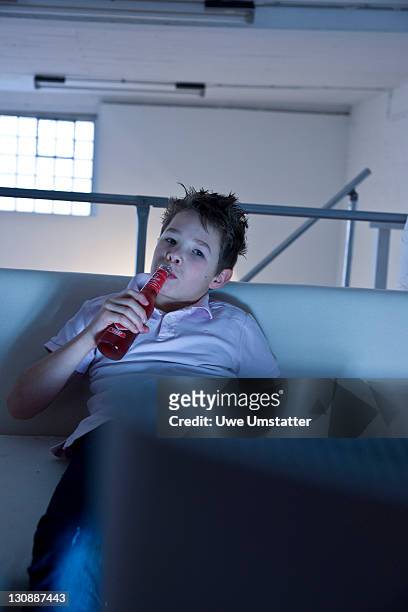 boy watching television - 10 11 years stock pictures, royalty-free photos & images