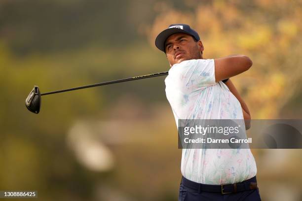 Sebastian Munoz of Colombia plays his shot on the sixth tee in his match against Jon Rahm of Spain during the first round of the World Golf...