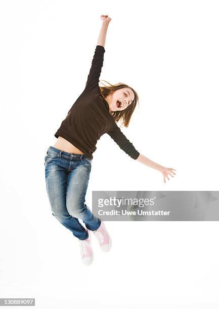 a girl leaping into the air - full body isolated bildbanksfoton och bilder