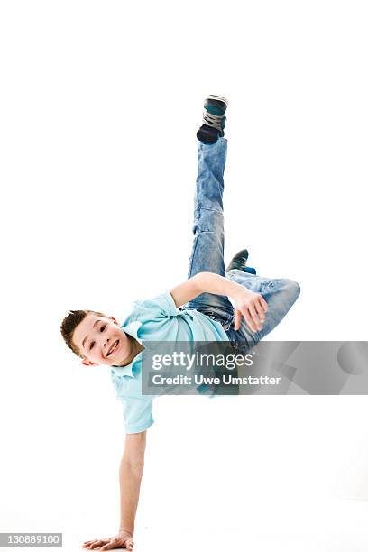 a boy leaping into the air - breaking and exiting stock pictures, royalty-free photos & images