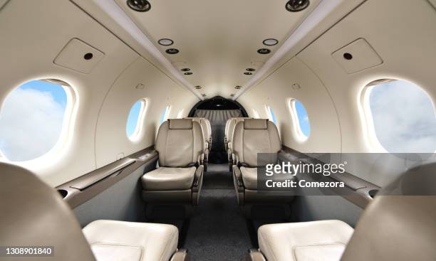 luxury passenger cabin - airplane interior stockfoto's en -beelden