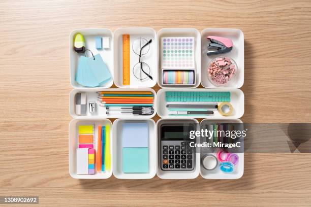 neatly organized stationery in white trays - organized desk stock pictures, royalty-free photos & images