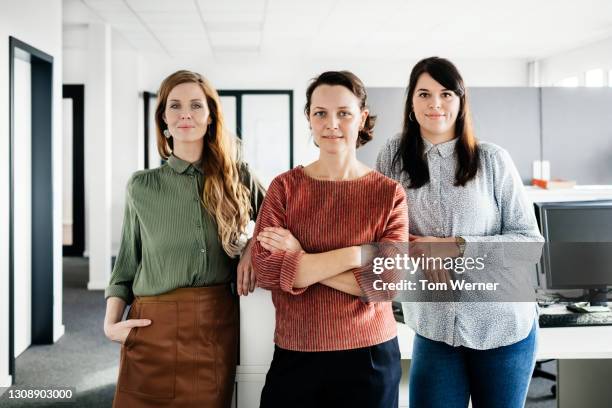 portrait of businesswomen in office - group of three people stock pictures, royalty-free photos & images