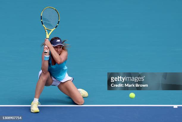 Danielle Collins of the United States returns a backhand during her women's singles first round match against Kristina Mladenovic of France on day...