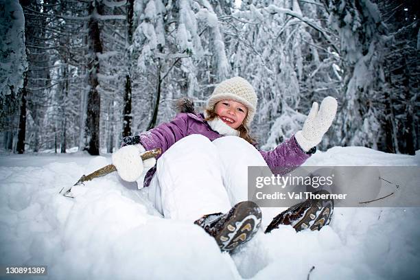 girl playing in a winter forest - traditionele koksmuts stockfoto's en -beelden