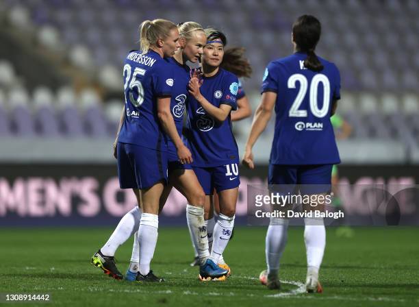 Pernille Harder of Chelsea celebrates with team mates Jonna Andersson and Ji So-Yun after scoring their side's second goal during the First Leg of...