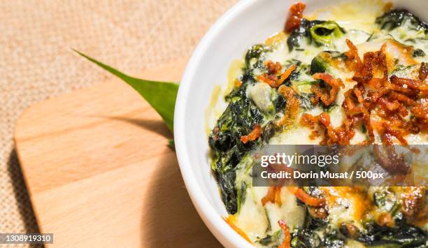 high angle view of food in bowl on table - spinach dip stock pictures, royalty-free photos & images