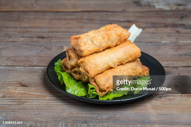 high angle view of fried food in plate on table - spring rolls stock pictures, royalty-free photos & images