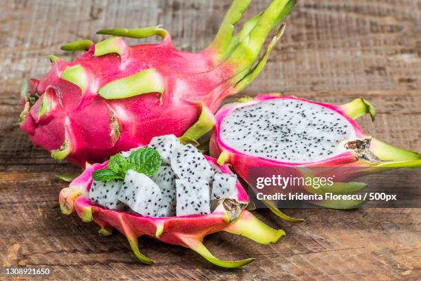 close-up of pitaya on table - röd pitahayafrukt bildbanksfoton och bilder