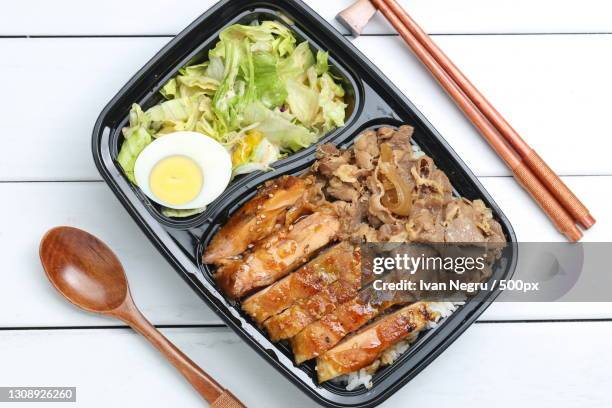 high angle view of food in container on table - bento box stock pictures, royalty-free photos & images