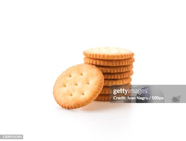 close-up of cookies against white background - crackers stock pictures, royalty-free photos & images