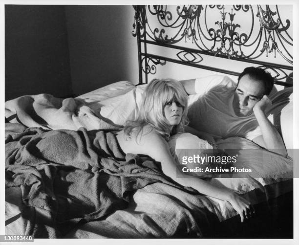 Brigitte Bardot and Michel Piccoli in bed in a scene from the film 'Contempt', 1963.