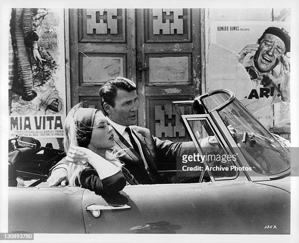 Brigitte Bardot and Jack Palance in car in a scene from the film 'Contempt', 1963.