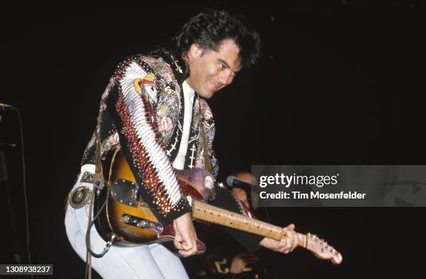 Marty Stuart performs at the Cow Palace on November 6, 1992 in South San Francisco, California.