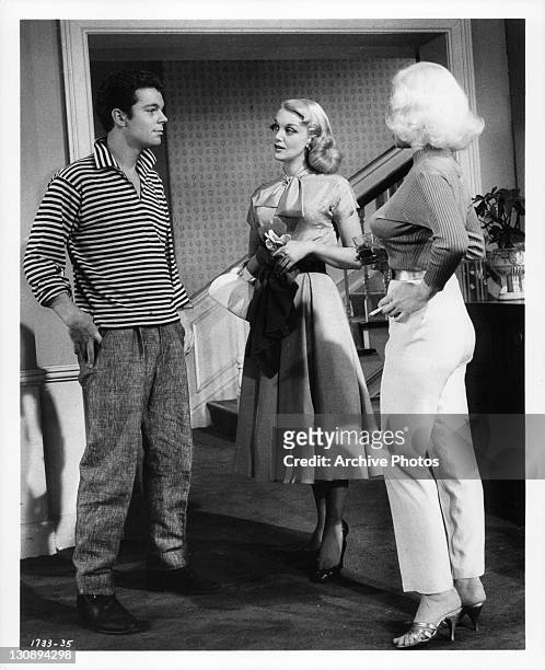 Russ Tamblyn facing Jan Sterling and Mamie Van Doren in a scene from the film 'High School Confidential!', 1958.