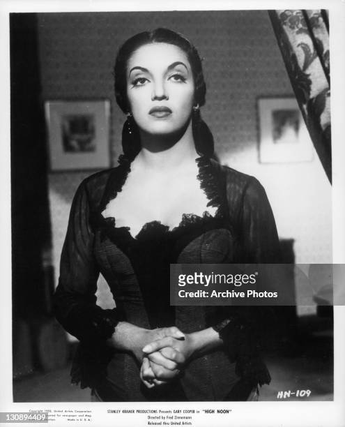 Katy Jurado holding her hands in a scene from the film 'High Noon', 1952.