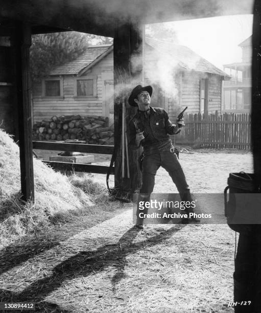 Lee Van Cleef in shootout in a scene from the film 'High Noon', 1952.