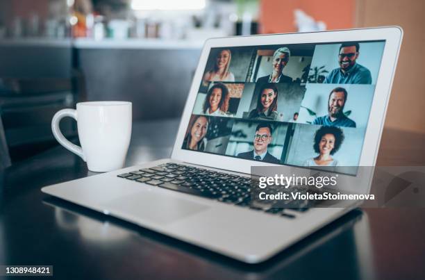 laptop with a video conference call on the screen. - business meeting coffee stock pictures, royalty-free photos & images