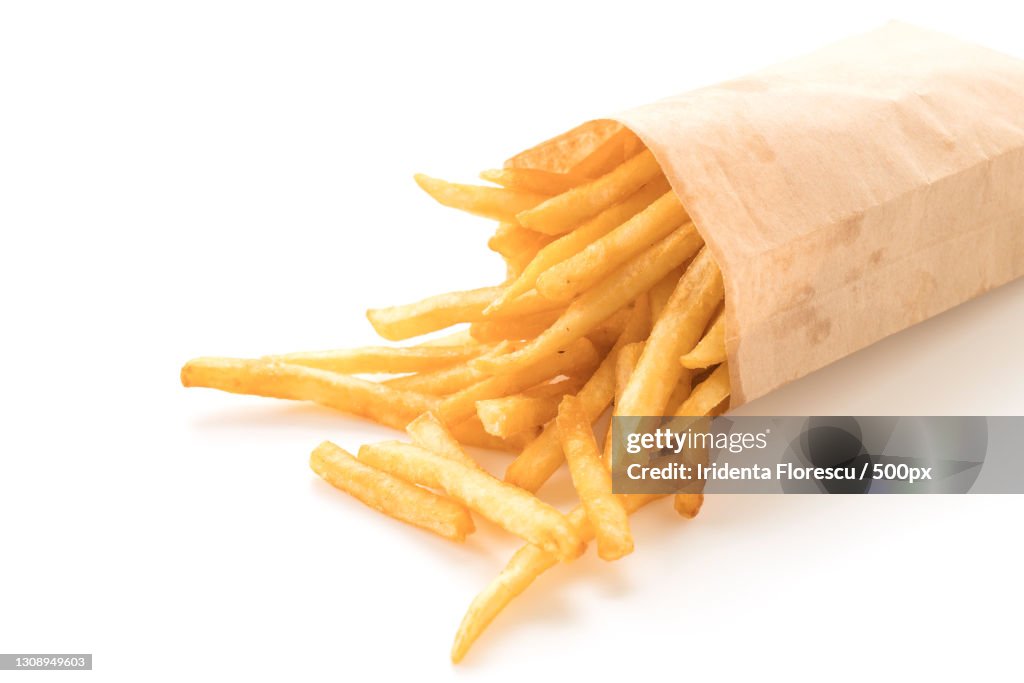 Close-up of french fries against white background