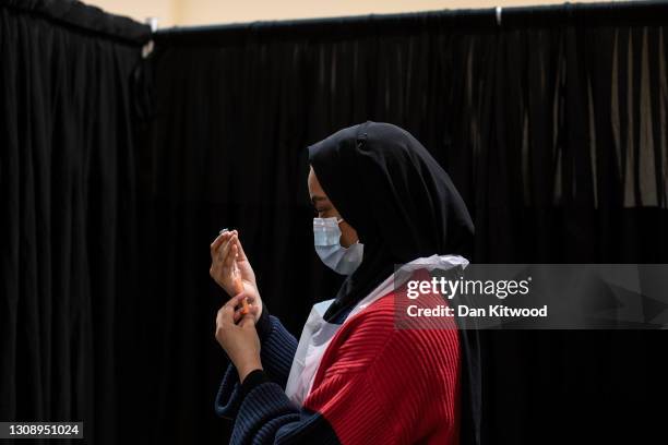 Nurse prepares the AstraZeneca jab at East London Mosque on March 24, 2021 in London, England. After weeks of tensions over Covid vaccine supplies,...