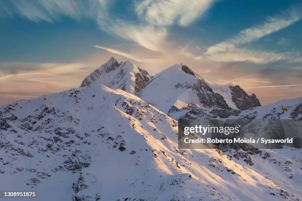 sunrise over the snowy piz bernina and biancograt, switzerland - st moritz stock pictures, royalty-free photos & images