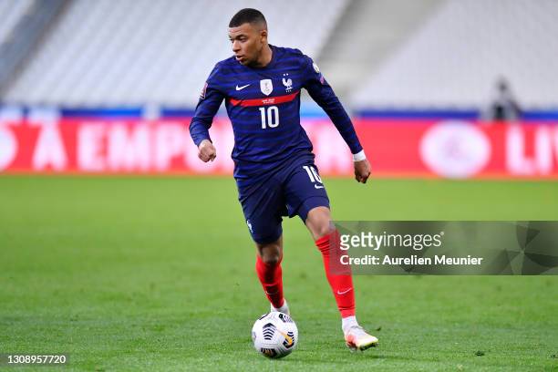 Kylian Mbappe of France runs with the ball during the FIFA World Cup 2022 Qatar qualifying match between France and Ukraine on March 24, 2021 in...