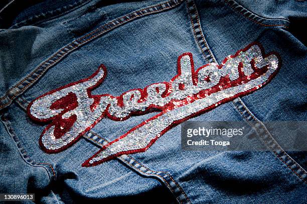 jean jacket with "freedom" patch - textile patch stock pictures, royalty-free photos & images