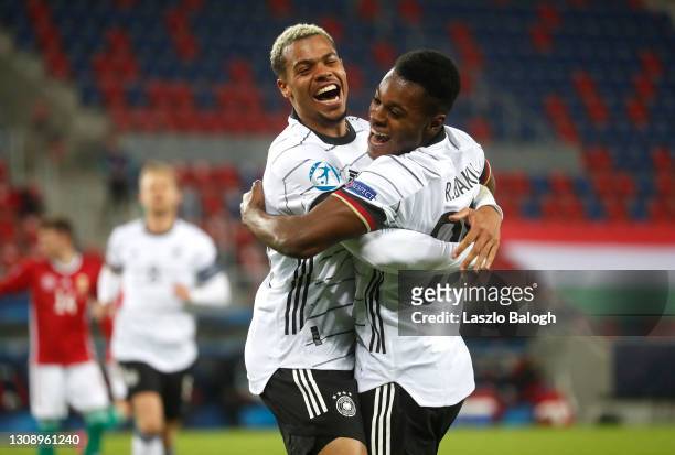 Bote Baku of Germany celebrates with teammate Lukas Nmecha after scoring his sides second goal during the 2021 UEFA European Under-21 Championship...