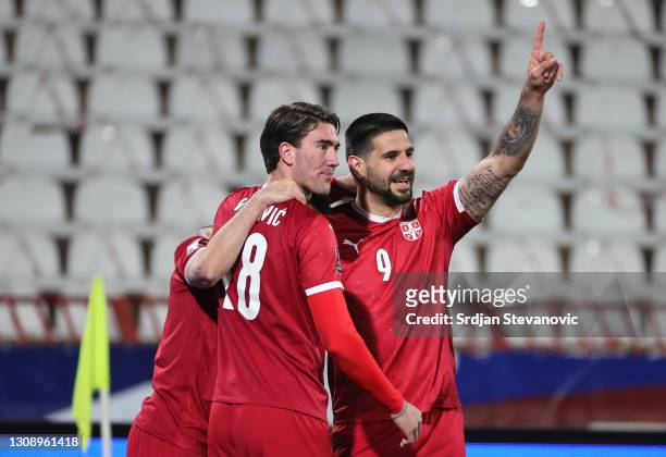 Aleksandar Mitrovic of Serbia celebrates after scoring his sides third goal with teammates Dusan Vlahovic and Milan Gajic during the FIFA World Cup...