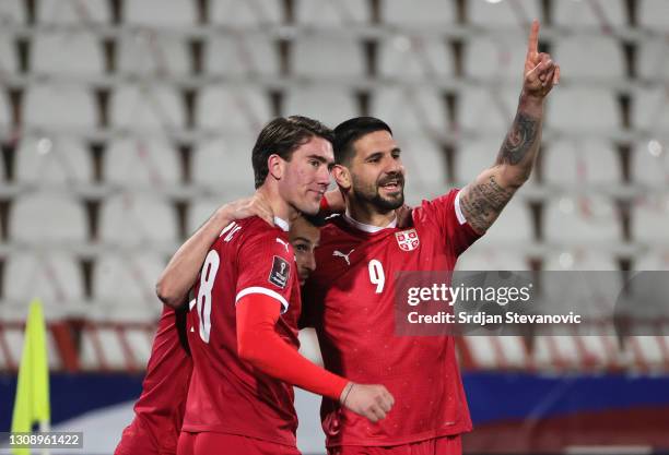 Aleksandar Mitrovic of Serbia celebrates after scoring his sides third goal with teammates Dusan Vlahovic and Milan Gajic during the FIFA World Cup...