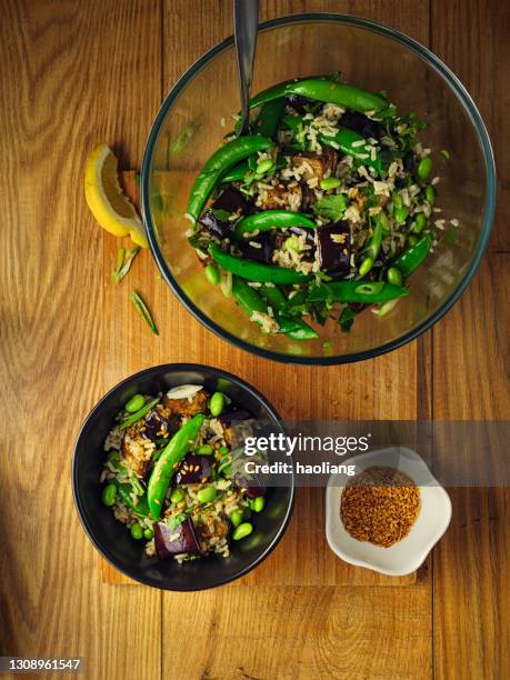 healthy vegan rice bowl - brown rice stock pictures, royalty-free photos & images