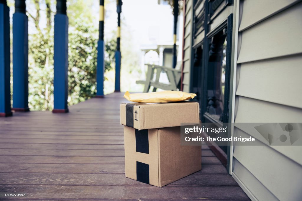 Stack of packages on front porch after mail delivery