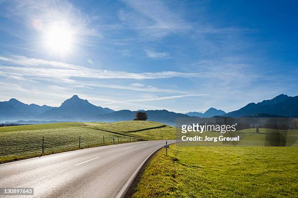 a country road near füssen - fassen foto e immagini stock