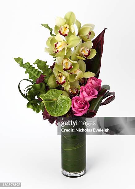 a bouquet of flowers in a vase - anthurium stock pictures, royalty-free photos & images