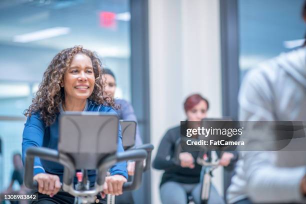 active senior woman at an exercise class - ymca stock pictures, royalty-free photos & images