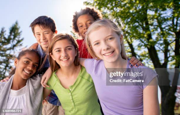 happy and smiling group of children - ymca stock pictures, royalty-free photos & images