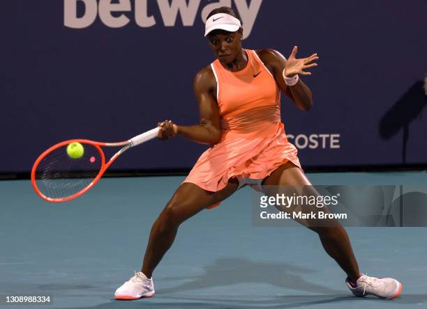 Sloane Stephens of the United States returns a shot during her women's singles first round match against Oceane Dodin of France on Day 3 of the 2021...